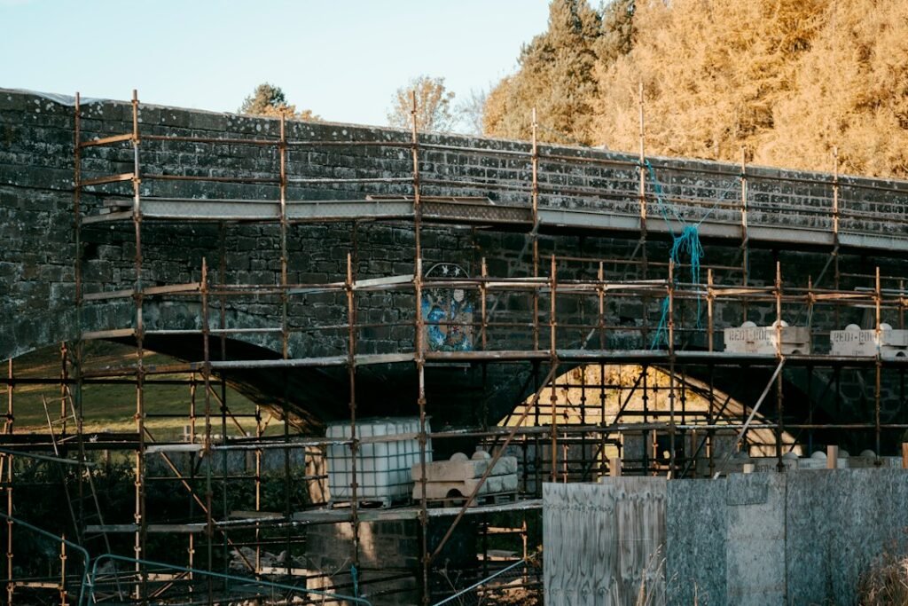Scaffolded bridge under construction, illustrating UK construction work.